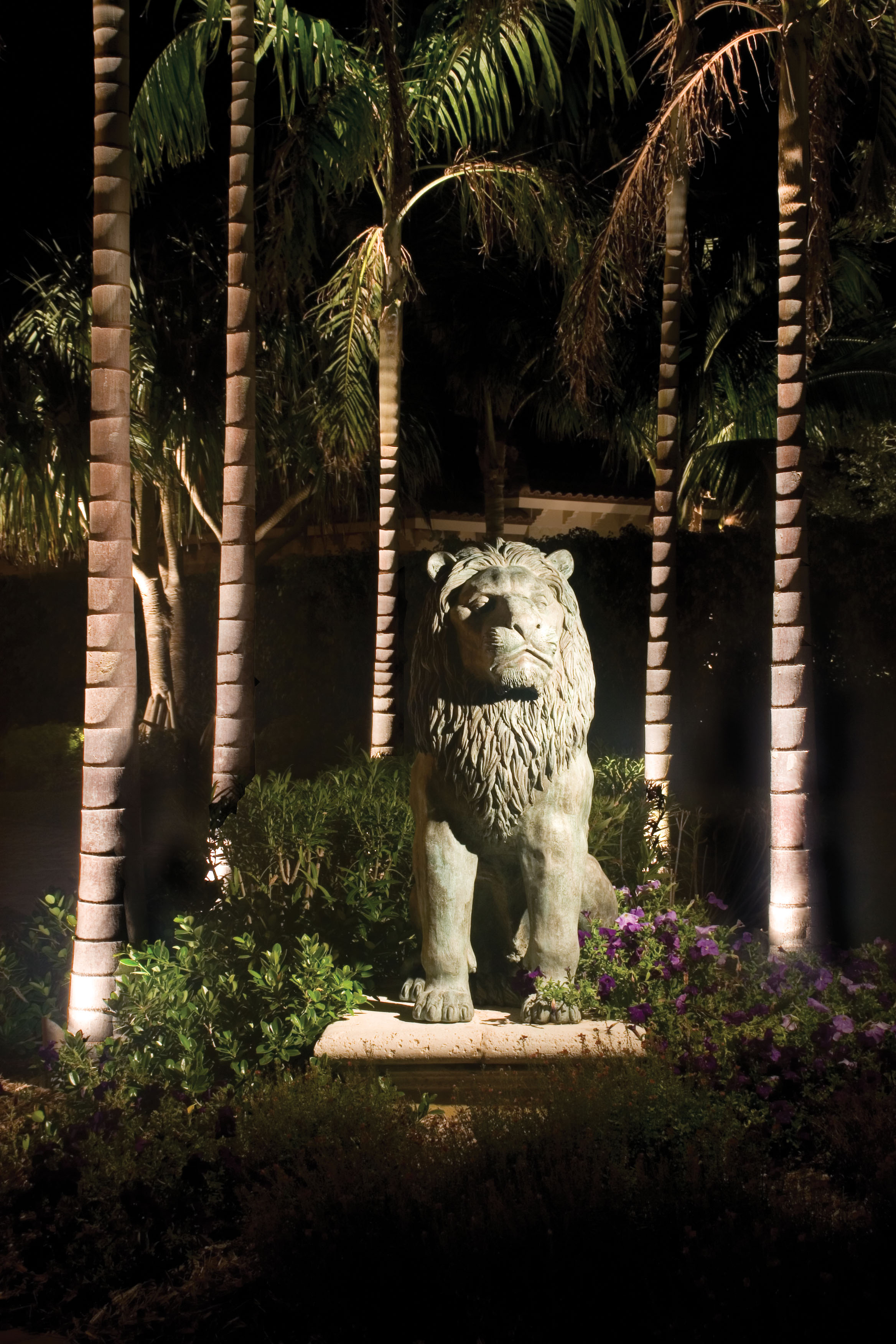 Lighting showing off a beautiful stone lion Hobe Sound